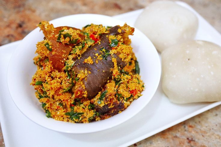 Assorted meats in egusi soup with stockfish and snails